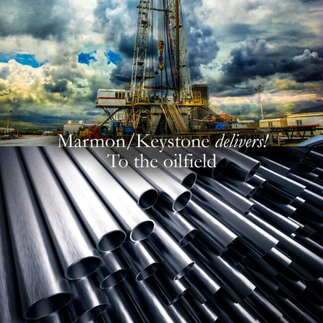 Marmon Keystone Rows of metal pipes are shown in the foreground with an oil drilling rig under a cloudy sky in the background. Text over the image reads, "Marmon/Keystone delivers! Your trusted metals distributor to the oilfield.