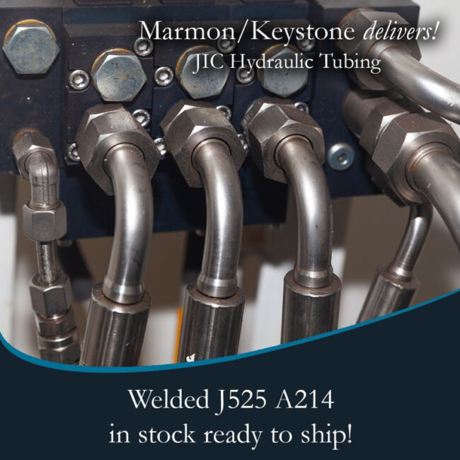 post-1-2 Marmon Keystone Close-up view of metal hydraulic tubes connected to fittings, highlighting Marmon/Keystone as your trusted metals distributor for JIC hydraulic tubing—welded J525 A214—available in stock and ready to ship for your supplychain needs.