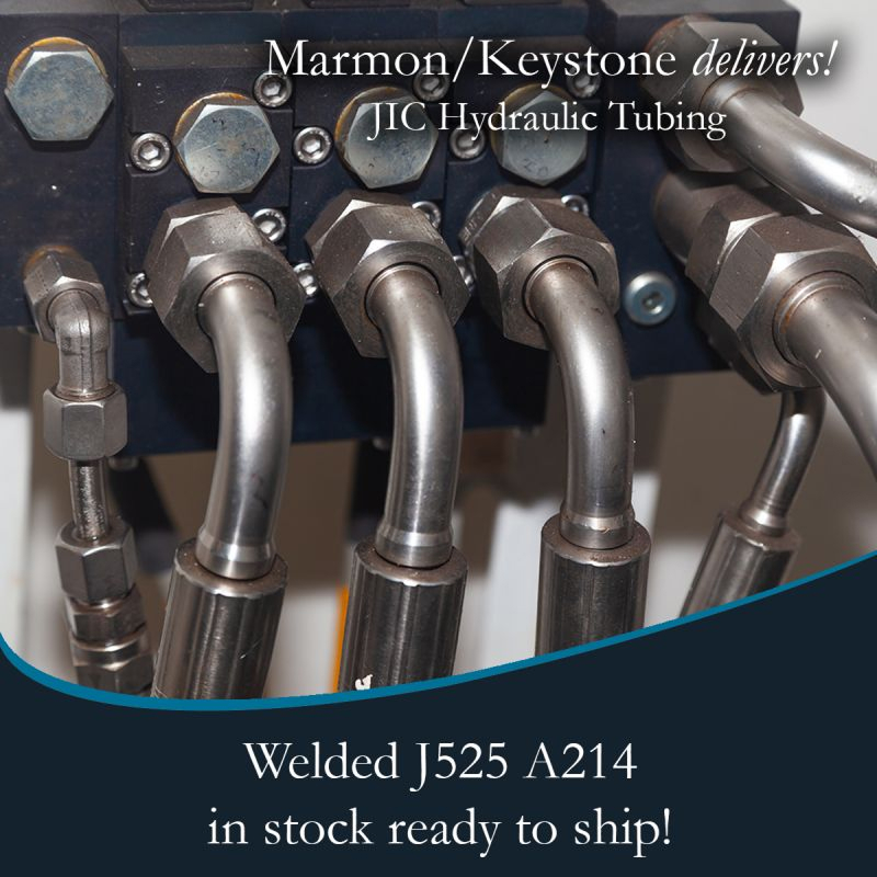 post-1-2 Marmon Keystone Close-up view of metal hydraulic tubes connected to fittings, highlighting Marmon/Keystone as your trusted metals distributor for JIC hydraulic tubingâwelded J525 A214âavailable in stock and ready to ship for your supplychain needs.